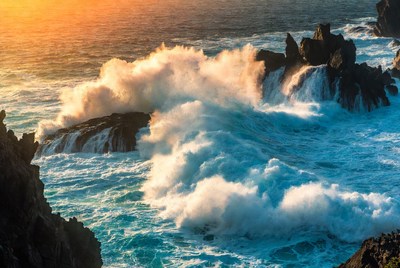 Waves crash against rocky coast