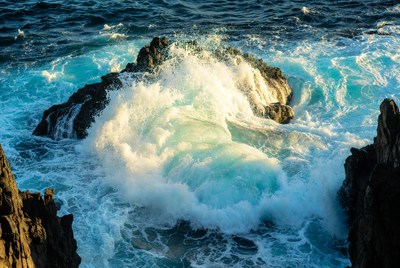Waves crash on rocky shore
