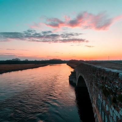 Sunset over river and bridge