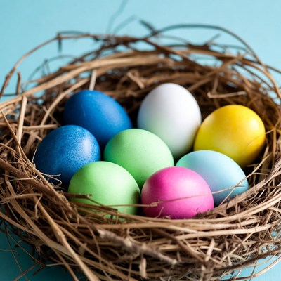 Colorful eggs in a straw nest