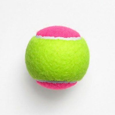 Bright tennis ball on white background
