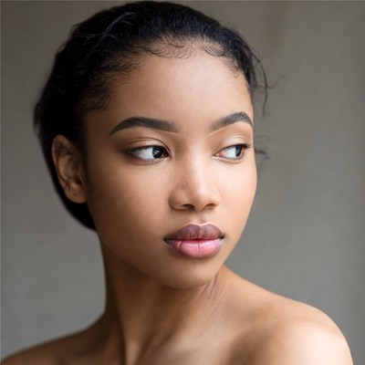 Portrait of a young woman looking away