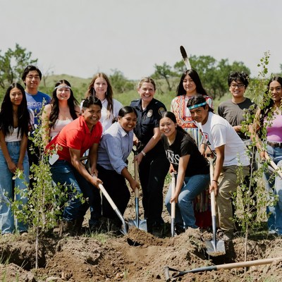 Community members plant trees together