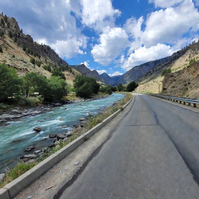 River beside mountain road in summer