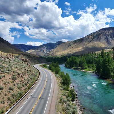 Road beside river in mountain view