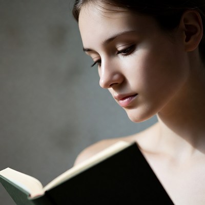 Girl reading a book indoors