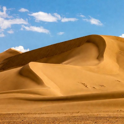Sand dunes under bright sky