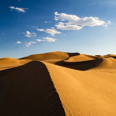 Sand dunes under a blue sky