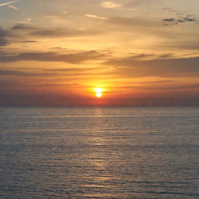 Sunset over the ocean horizon