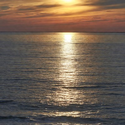 Sunset over calm ocean waters