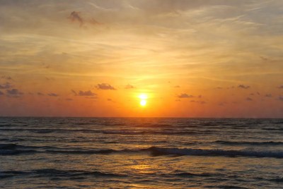 Sunset over the ocean waves