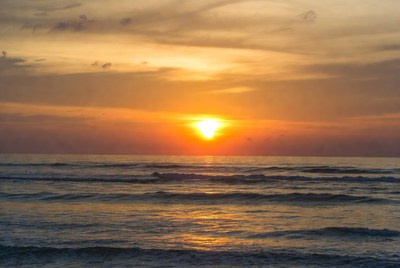 Sunset over the ocean horizon