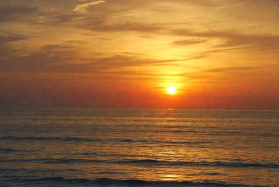 Sunset over calm ocean waters