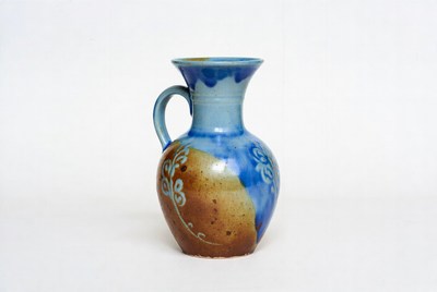 Decorative ceramic pitcher in blue and brown