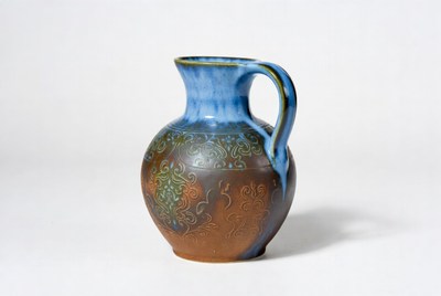 Ceramic jug with blue glaze decoration