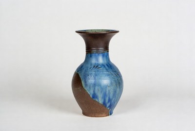 Handmade pottery vase with blue glaze