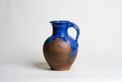 Clay pitcher with blue detail