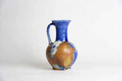Ceramic jug in blue and brown colors