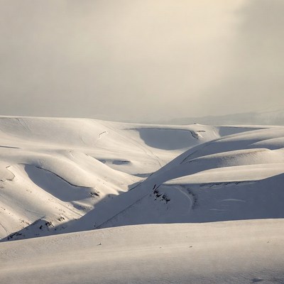 Snowy hills in winter landscape