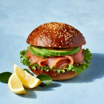 Fresh smoked salmon sandwich on a blue background