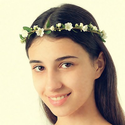 Girl with flower crown smiling