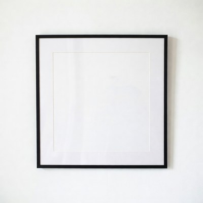 Empty frame on white wall
