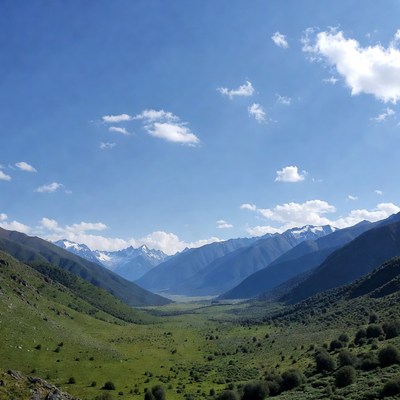 Mountains and valley under blue sky