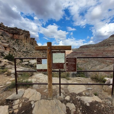 Hiking trail sign in canyon area