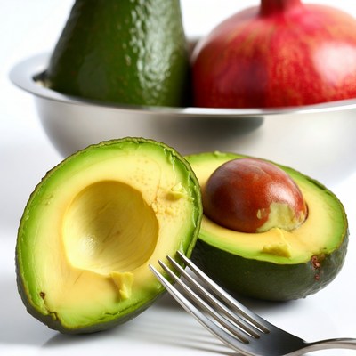 Fresh avocado and apple in bowl