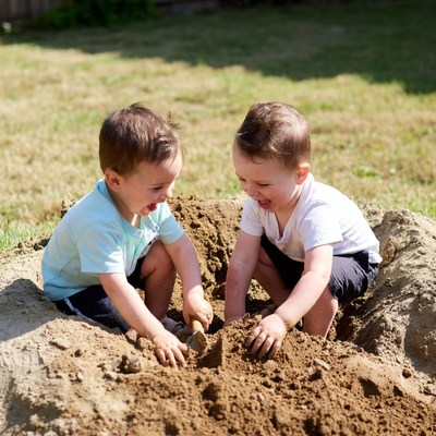 Children playing in dirt together