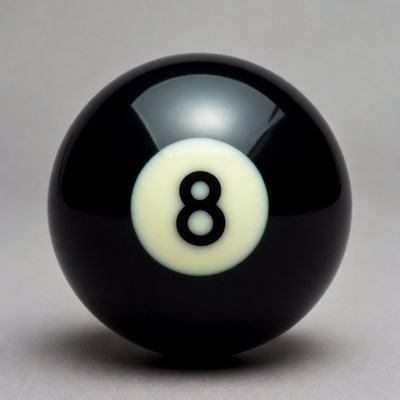 Black eight ball on plain surface