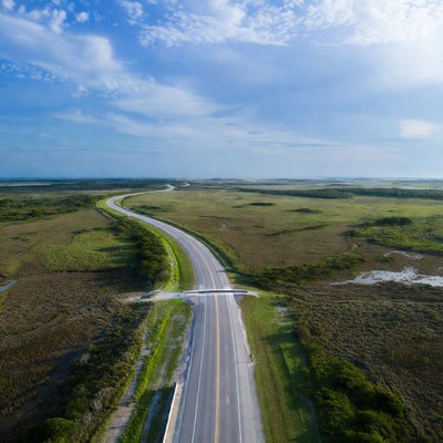 Scenic view of winding road in coastal area