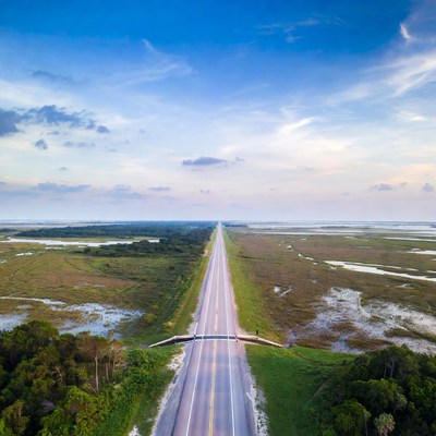 Long road through wetland area