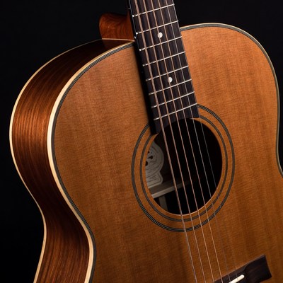 Acoustic guitar on black background