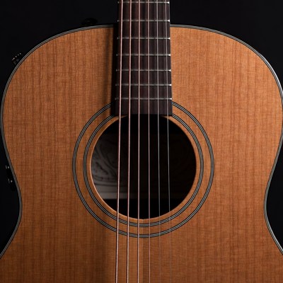 Close view of guitar strings and body