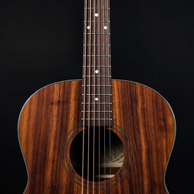 Acoustic guitar close up on dark background