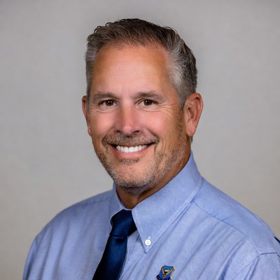 Man in blue shirt with smile