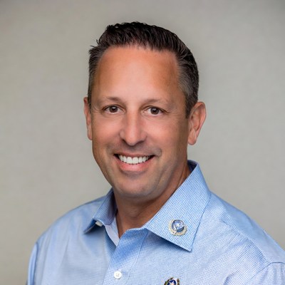 Man in blue shirt smiling