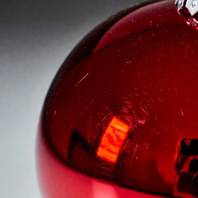 Red ornament close-up on a surface