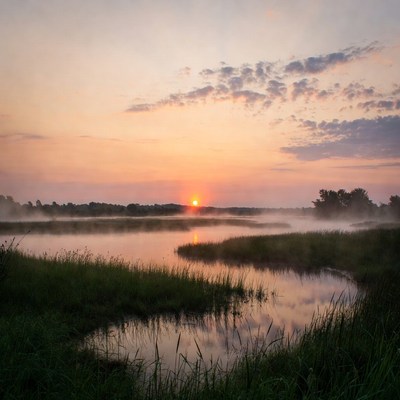 Sunset over river and mist