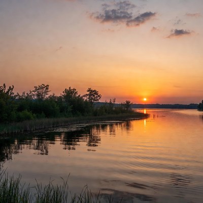 Sunset over calm waters in nature