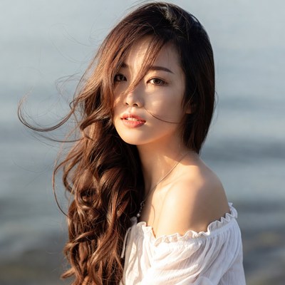 Woman by the water during daylight