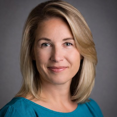 Woman in blue top smiling