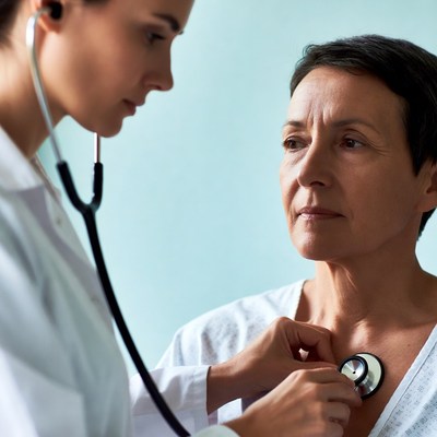 Doctor checks patient for health issues