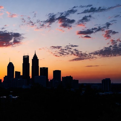 City skyline at sunset with clouds