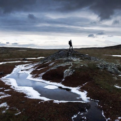 Person standing on rock in landscape