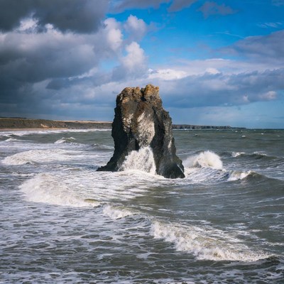 Waves crashing on rocky shore