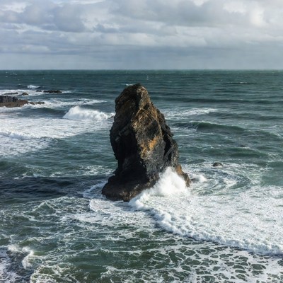 Rock in the ocean waves near the coast