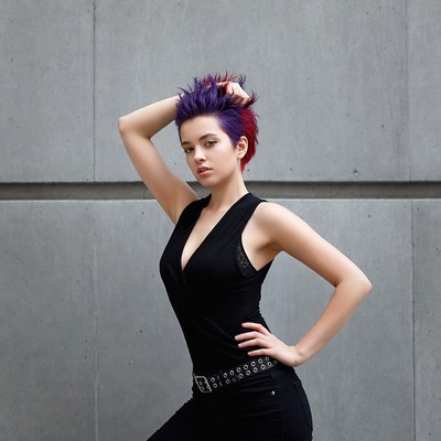 Model poses in urban setting