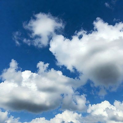 Clouds in a clear sky overhead